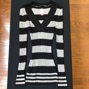 Black and white striped V neck sweater.